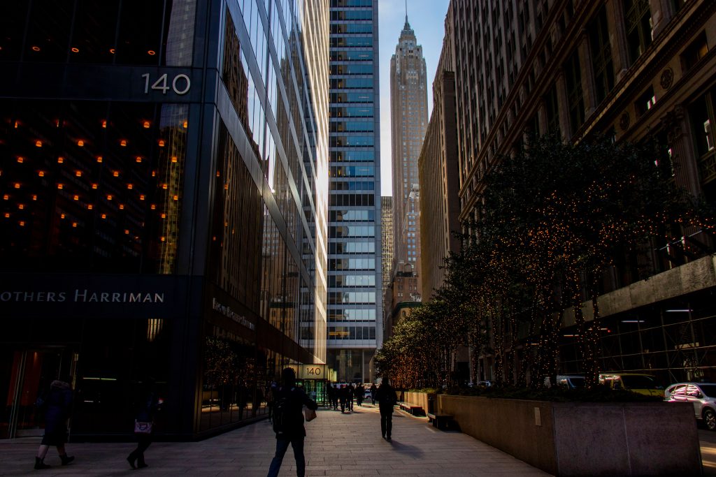 Street-level view between New York City skyscrapers